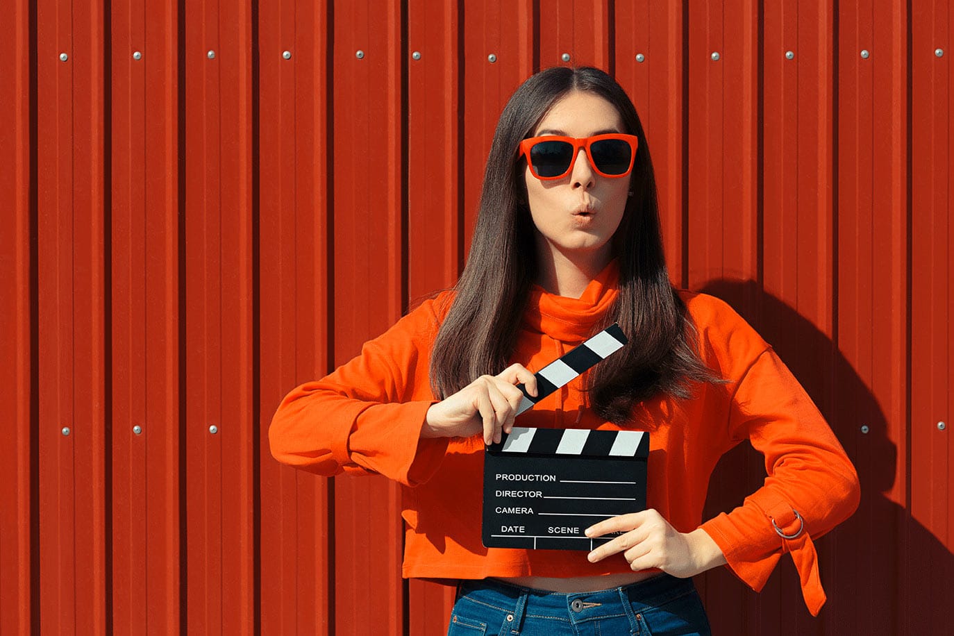 girl with movie clapboard